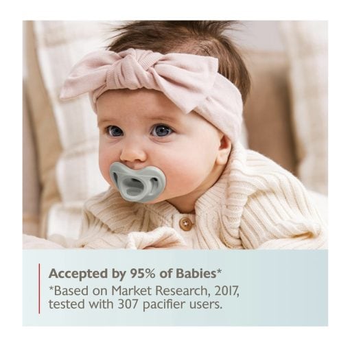 Baby with pacifier wearing a pink headband, close-up of infant, adorable newborn, baby care, soothing pacifier, BabyDashNow Stamford delivery service.